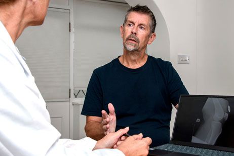 Agitated patient speaking with doctor